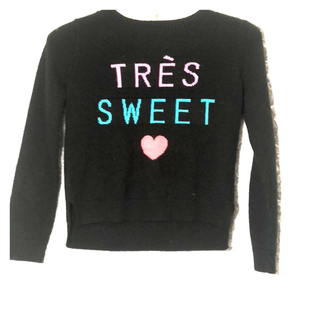 High low girl’s sweater.